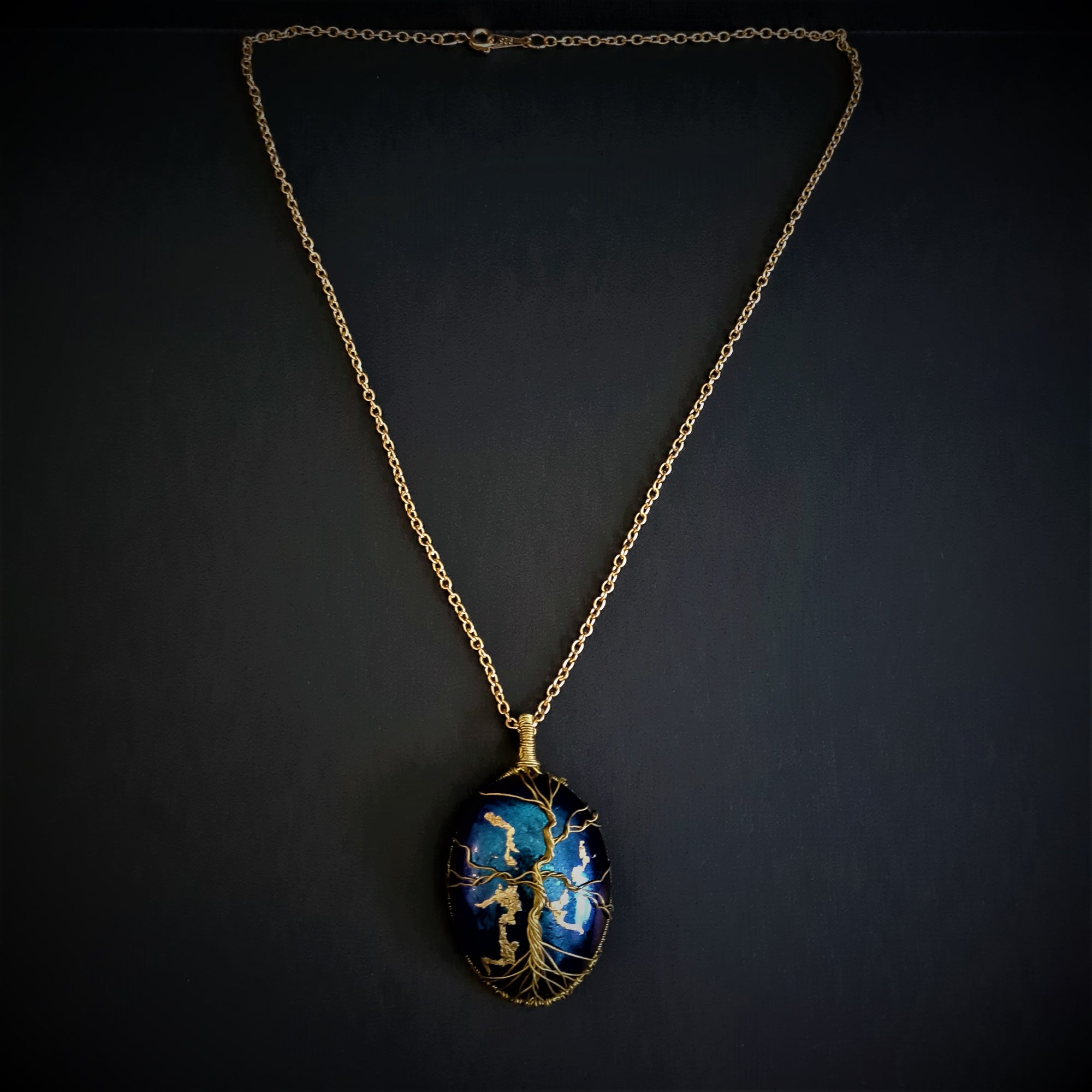 Tree of life with opal shaped blue iridescent pendant and necklace